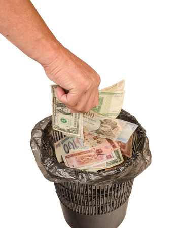 money in a recycle binの写真素材