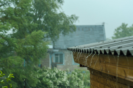 rain flows down from a roof down