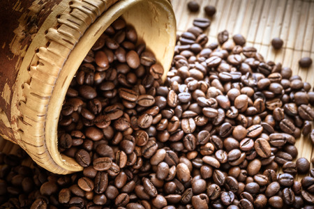 coffee grains on grunge wooden backgroundの写真素材