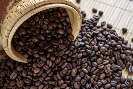 coffee grains on grunge wooden backgroundの写真素材