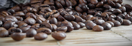 coffee grains on grunge wooden backgroundの写真素材