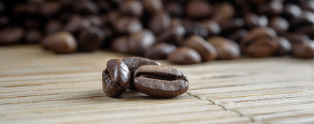 coffee grains on grunge wooden backgroundの写真素材