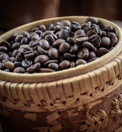 coffee grains on grunge wooden backgroundの写真素材
