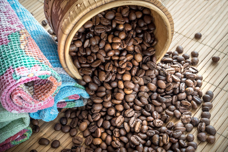 coffee grains on grunge wooden backgroundの写真素材