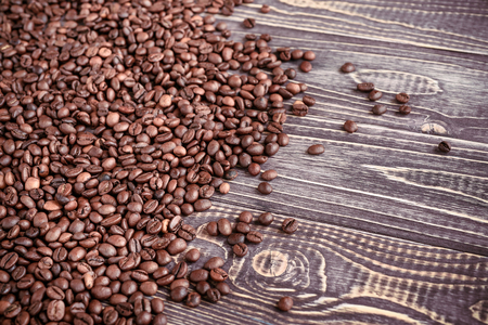 Background with coffee beans and wood textureの写真素材