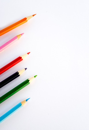 Color pencils on white paper background. Copy space.の写真素材