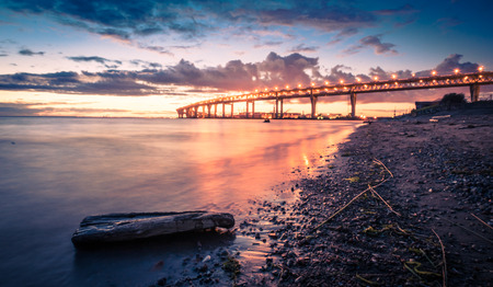 Sea shore night landscape. The Gulf of Finland. Bridge over the bay in St. Petersburg Petersburgの写真素材