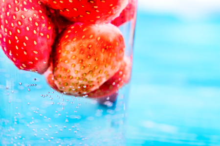Macro photo texture of juicy strawberriesの写真素材
