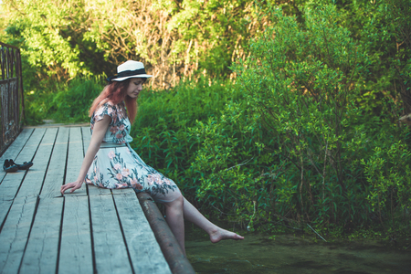 Girl, nature, walk and the concept of travel-beautiful girl on the bridgeの写真素材