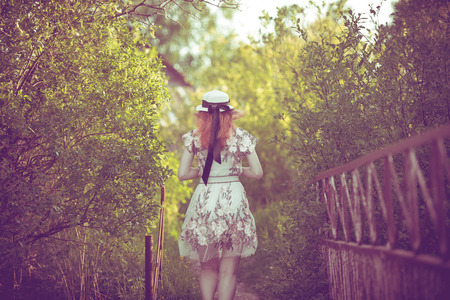 Girl, nature, walk and the concept of travel-beautiful girl on the bridgeの写真素材