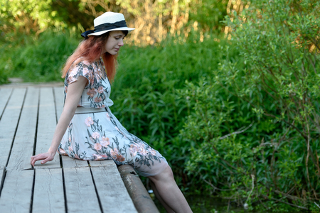 Girl, nature, walk and the concept of travel-beautiful girl on the bridgeの写真素材
