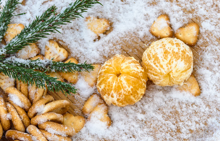 Mandarins, snow, spruce branches - Christmas background and concept of the new compositionの写真素材