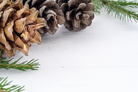 Christmas decorations on dark wooden background. Cones and spruceの写真素材