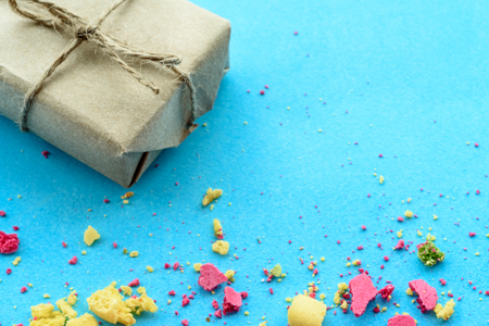 Blue background with gifts and crumbs of a multi-colored cake, tの写真素材