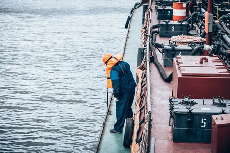Saint Petersburg, Russia - July 30, 2019: the Doctrine on liquidation of oil spill in the sea port. Rescue service at work.の写真素材