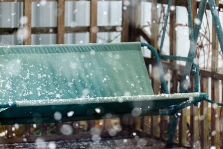 Snow is falling outside - cold weather and frosts at the beginning of the seasonの写真素材