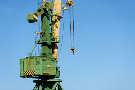 Russia, Saint Petersburg, may 30, 2020: Close-up of a fragment of a port sea crane against the blue skyのeditorial素材