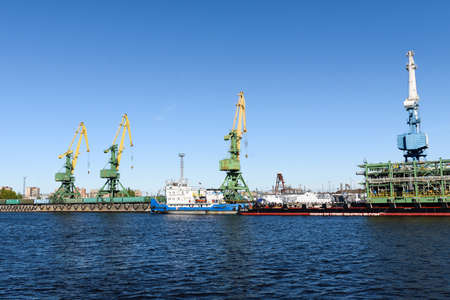 Russia, Saint Petersburg, may 30, 2020: View of the seaport. Cranes and ships.のeditorial素材
