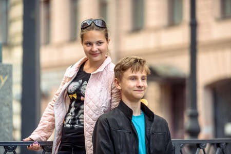 Russia. St. Petersburg, July 24, 2019: Teenagers a boy and a girl walk around the city on a weekendのeditorial素材