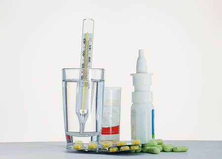 Medical thermometer and tablets-seasonal diseases and treatmentsの写真素材