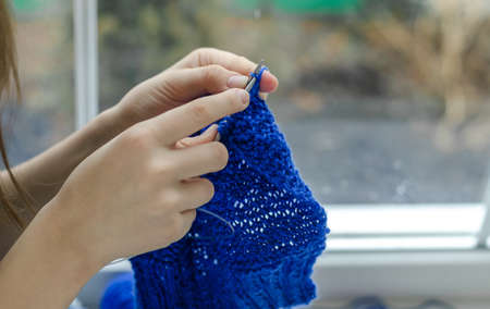 Close up on woman's hands knittingの写真素材
