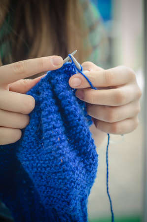 Close up on woman's hands knittingの写真素材