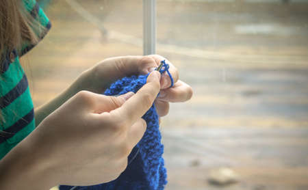 Close up on woman's hands knittingの写真素材