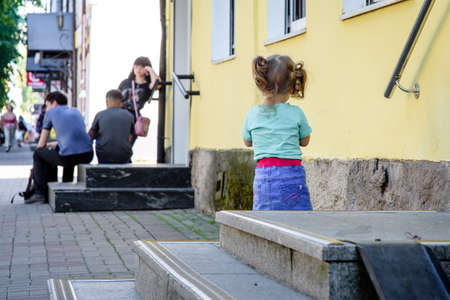 Russia, Gatchina, June 25, 2020: people walk along the city streets. Life after quarantine. Blurred background.の写真素材