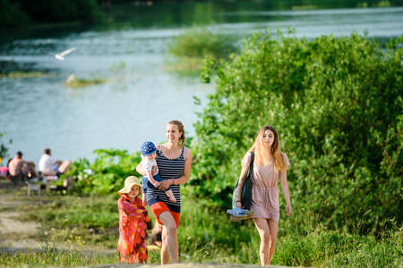 Russia, Saint Petersburg, June 24, 2020: People relax on the lake on a hot summer dayのeditorial素材