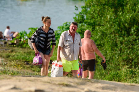 Russia, Saint Petersburg, June 24, 2020: People relax on the lake on a hot summer dayのeditorial素材