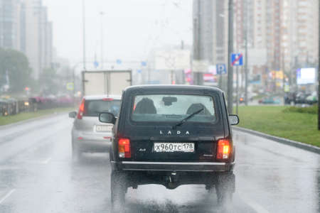 Russia, St. Petersburg, August 26, 2020: traffic on the bypass road during the rain. Bad weather and driving.のeditorial素材