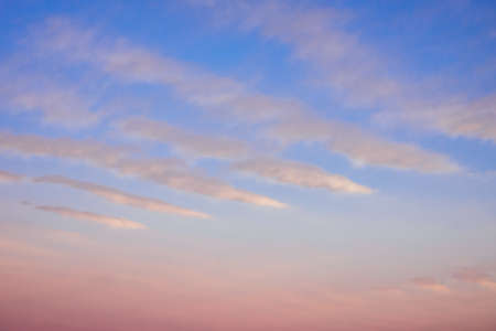 Beautiful pink clouds on the blue sky during sunset. Beautiful natural backgroundの写真素材