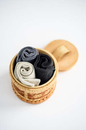 Men's socks in a round box on a white background - close-upの写真素材
