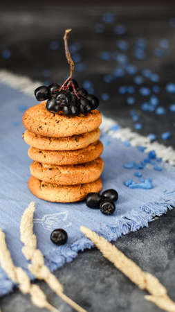 Fresh oatmeal cookies on a dark backgroundの写真素材