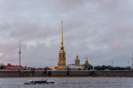 Russia, St. Petersburg, June 2021: View of the Arrow of Vasilievsky Island from the Neva River. Rostral columns at sunset.のeditorial素材