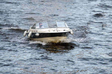 Russia, St. Petersburg, June 2021: A pleasure boat sails on the Neva Riverのeditorial素材