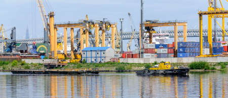 Russia, Saint Petersburg, May 2021: Sea Cargo Port, cranes and shipsのeditorial素材