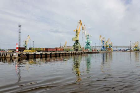 Russia, Saint Petersburg, May 2021: Sea Cargo Port, cranes and shipsのeditorial素材