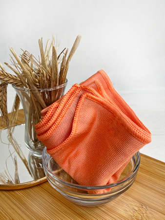 Microfiber cloth for cleaning jewelry on a green backgroundの写真素材