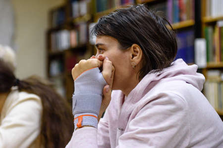 Russia Saint Petersburg November 2021: A young woman in the classroom listens to a lessonのeditorial素材
