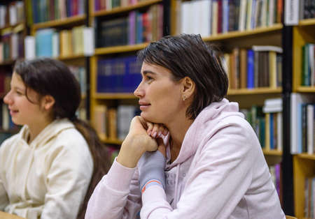 Russia Saint Petersburg November 2021: A young woman in the classroom listens to a lessonのeditorial素材