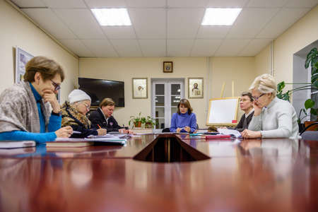 Russia St. Petersburg November 2021: Elderly people in the parish school in the classroomのeditorial素材