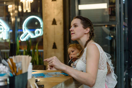 Russia, Gatchina, November 20212: Young mothers with children gathered to spend time in a barのeditorial素材