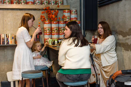 Russia, Gatchina, November 20212: Young mothers with children gathered to spend time in a barのeditorial素材