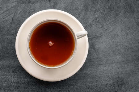 A cup of tea on a black background top viewの写真素材