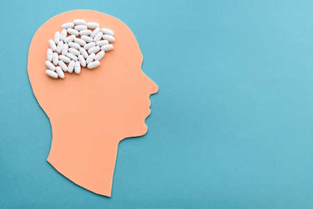 head with pills in the form of an abstract brain.
