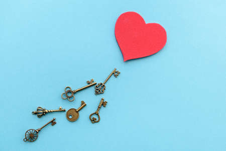 Vintage keys with a red heart. Valentine's Day background. The concept of the key to the heart.