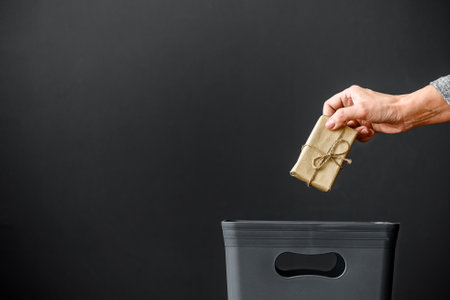 The gift is thrown into the trash. The concept of recycling.の写真素材