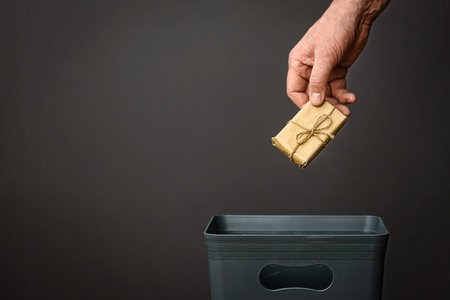 The gift is thrown into the bucket. An unnecessary gift.の写真素材