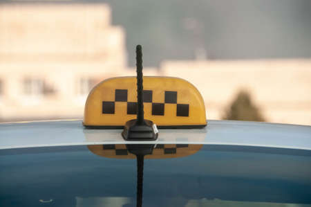 The roof of a taxi with a checker close-up.の写真素材